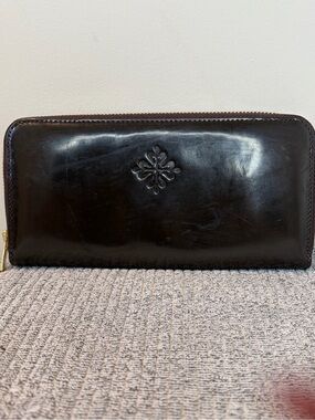 Authentic Patek Philippe Dark Brown leather zip around wallet.